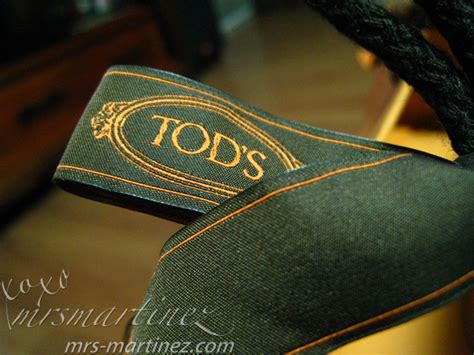 how to spot a fake tods bag|tods purse logo.